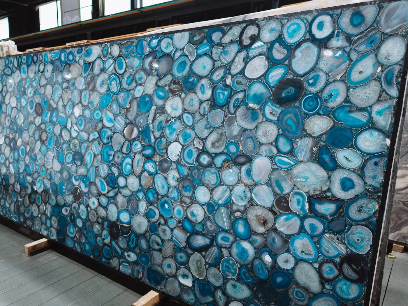 A backlit blue agate semi-precious slab set in a steel frame