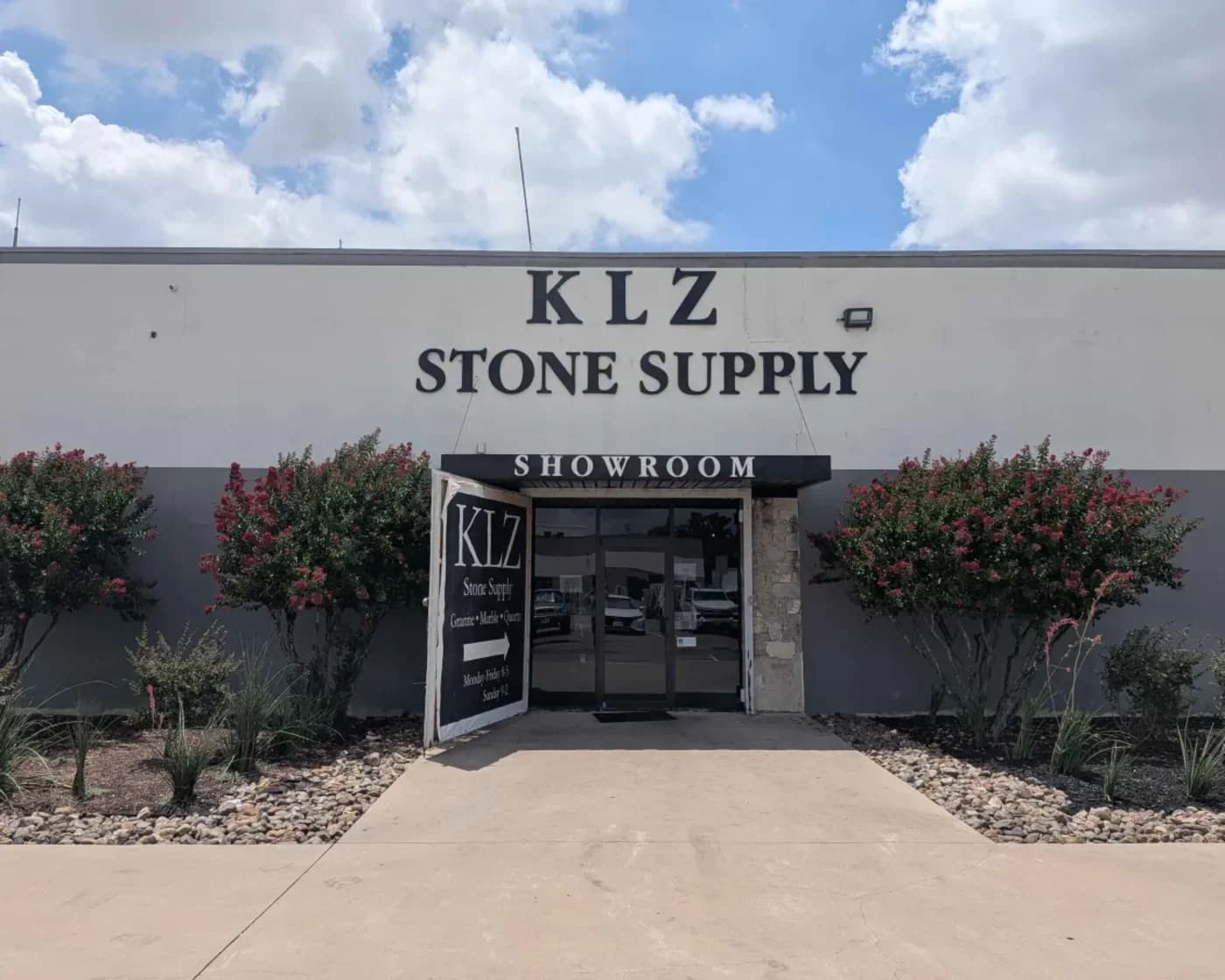 The KLZ Stone Supply showroom, its sign above the entrance reading KLZ Stone Supply, Showroom